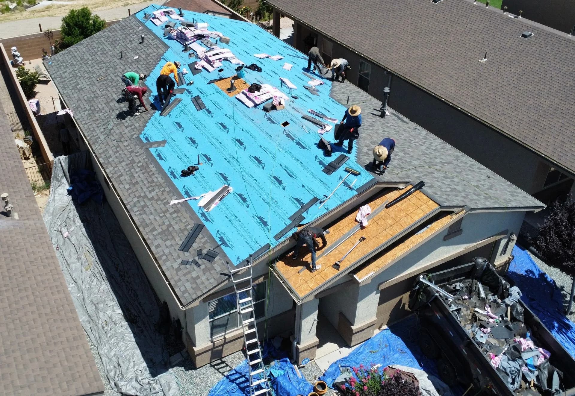 Shingle re-roof underlayment installation, aerial view